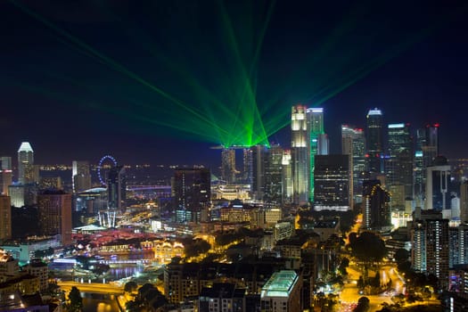 Singapore Central Business District Skyline and Laser Light Show at Blue Hour Evening