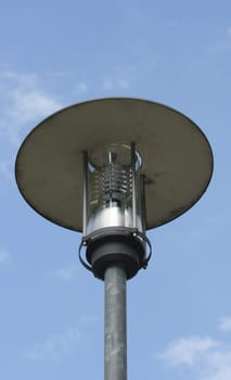 Street lamp with large umbrella,blue sky in the background