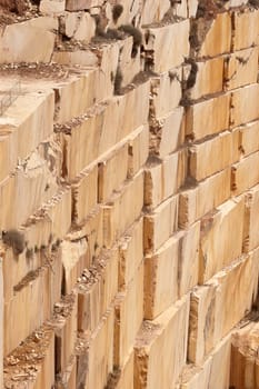 Wall of a marble quarry with marks left after extraction of the blocks, Alentejo, Portugal