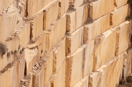 Wall of a marble quarry with marks left after extraction of the blocks, Alentejo, Portugal