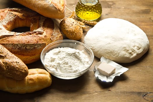 ingredients for homemade bread on wooden background