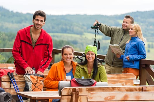 Young caucasian friends relaxing mountain countryside view summer sport