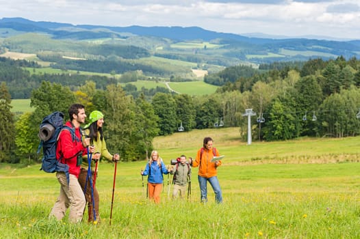 Young trekking people enjoying nature and scenic landscape