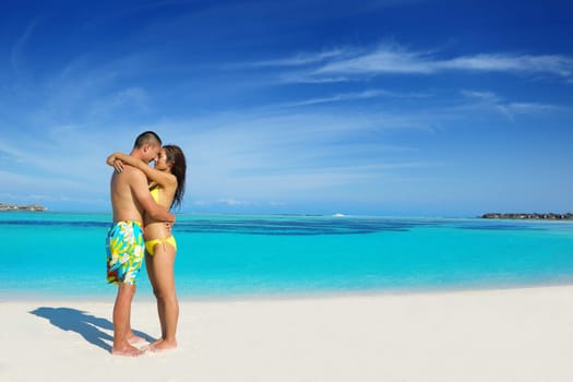 happy young asian couple have fun and romantic time at  summer on beautiful white sand beach