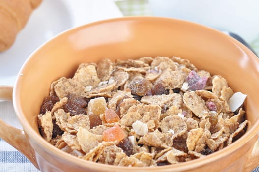 A bowl of muesli and milk. Breakfast.
