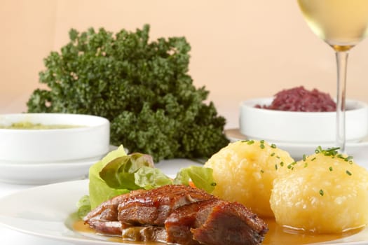 Goose breast and dumplings with red cabbage