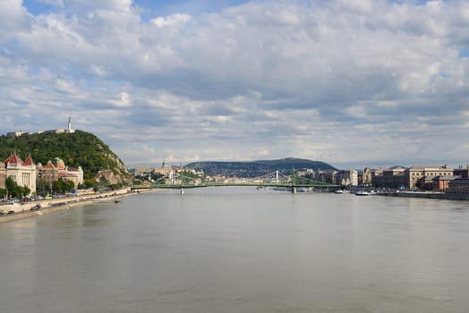Liberty Bridge between Gellert hill and Pest from river the Danube. Budapest - Hungary