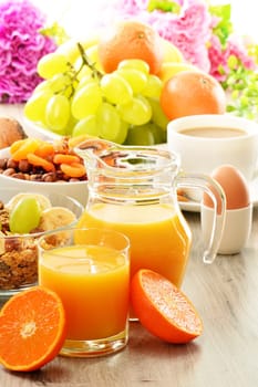 Breakfast including coffee, bread, honey, orange juice, muesli and fruits
