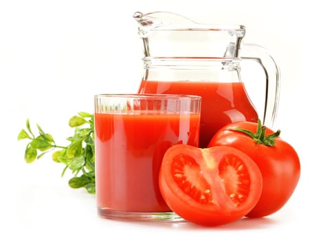 Composition with glass and jug of tomato juice isolated on white