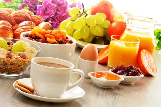 Breakfast including coffee, bread, honey, orange juice, muesli and fruits