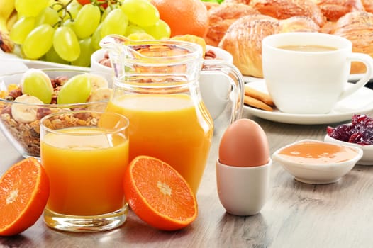 Breakfast including coffee, bread, honey, orange juice, muesli and fruits