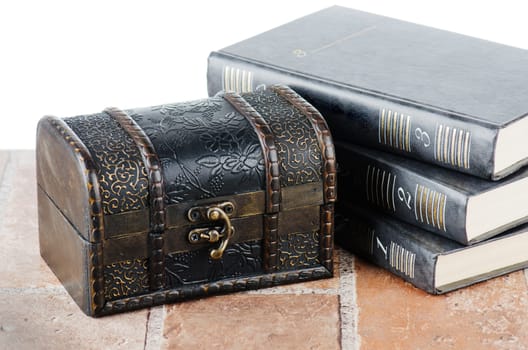 Chest and pile of books