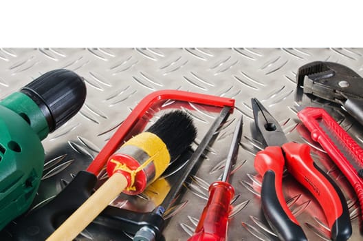 Set of working tools on a metal surface