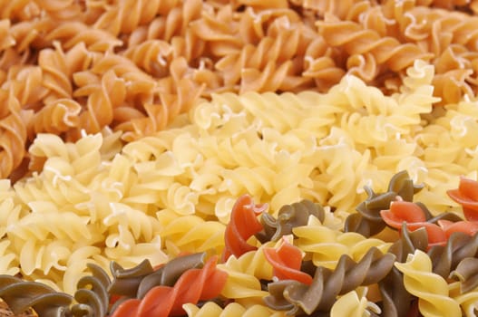 Three colored pasta over white, background