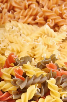 Three colored pasta over white, background