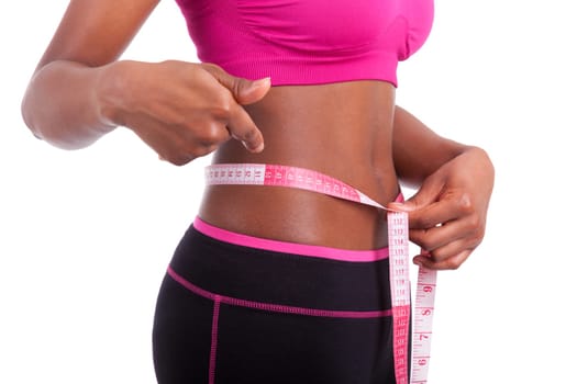 African American Fitness woman showing her belly, isolated on white background