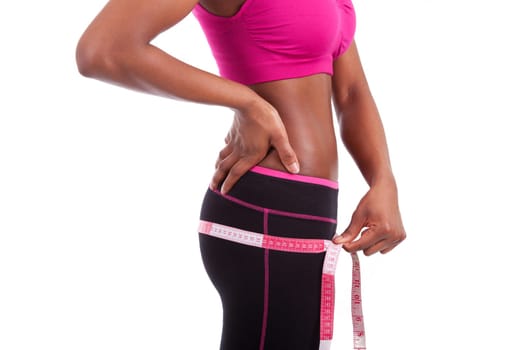 African American Fitness woman measuring her belly, isolated on white background