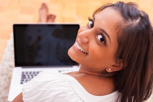 Young beautiful indian woman using a laptop