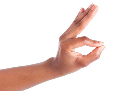 Closeup of woman's hand gesturing - showing ok sign, isolated on white background