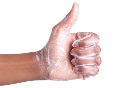 Soapy African American womens hand making thumbs up,isolated on white background