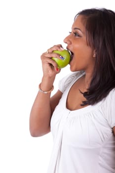 Young indian woman eating an apple, isolated on white background