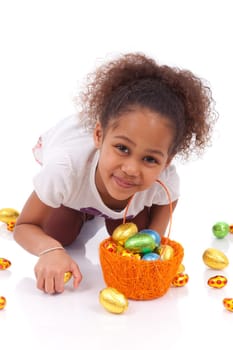 African Asian girl holding chocolate ester egg, isolated on white background