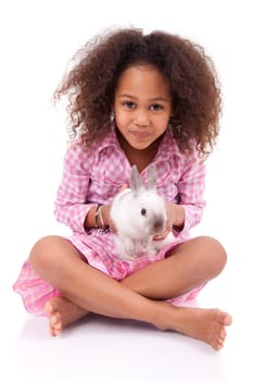 African Asian girl holding a rabbit, isolated on white background