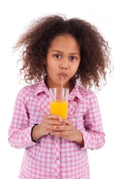 Little african asian girl drinking orange juice,isolated on white background