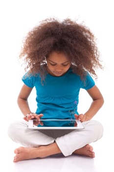 Little african asian girl using a tablet  pc, isolated on white background