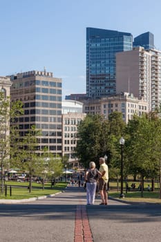 Freedom trail red line crossing common park in Boston  Massachusetts