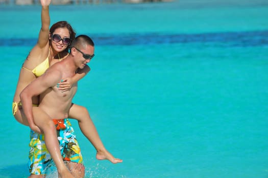 happy young asian couple have fun and romantic time at  summer on beautiful white sand beach