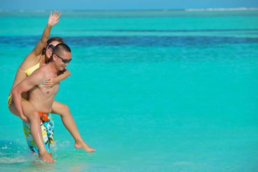 happy young asian couple have fun and romantic time at  summer on beautiful white sand beach