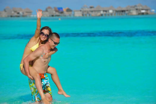 happy young asian couple have fun and romantic time at  summer on beautiful white sand beach