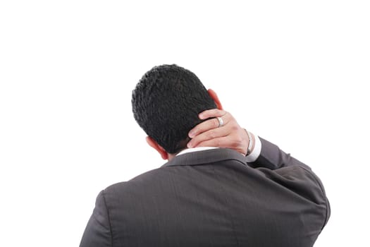 Young businessman having neck pain