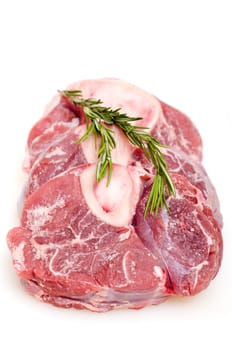 Raw veal leg slices with rosemary