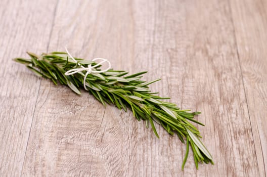 A bunch of rosemary on old wood