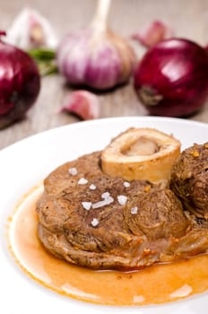 Ossobuco with sauce on a plate
