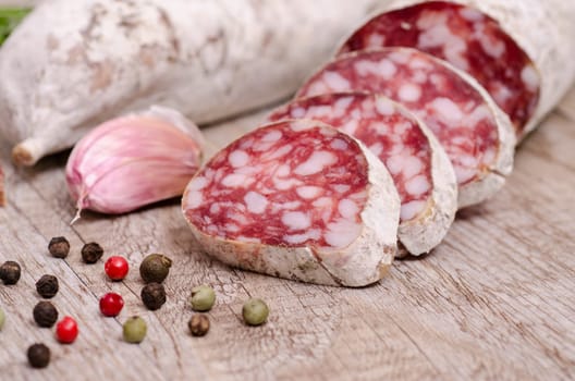 Close-up salami sausage with peppercorns