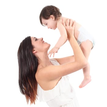 Beautiful mother raising her daughter looking with tenderness isolated on a white background