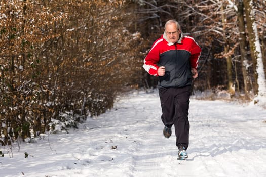 Senior jogging in winter