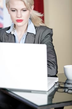Attractive woman working on her laptop catching up after a long day.