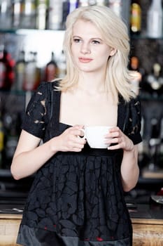 attractive woman waiting for someone at a wine bar.
