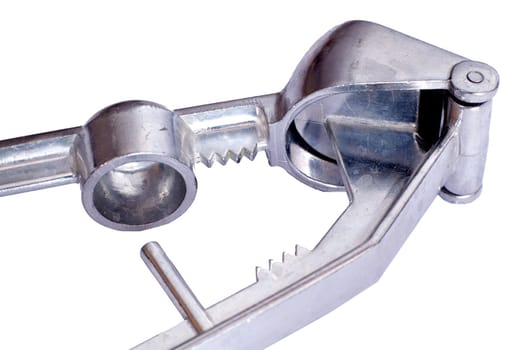 Metal garlic press isolated on white background