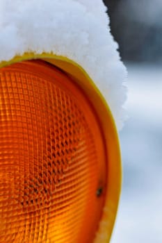Construction site lamp in the snow