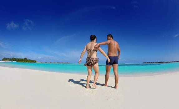 happy young asian couple have fun and romantic time at  summer on beautiful white sand beach