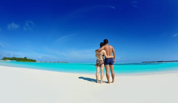 happy young asian couple have fun and romantic time at  summer on beautiful white sand beach