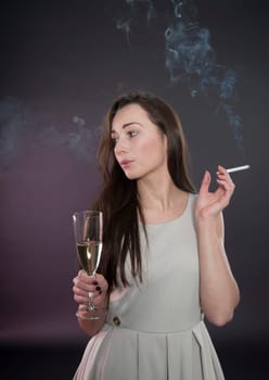 Woman with cigarette and alcohol