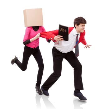 Young woman with a box on her head grab a young man with Bible in hand