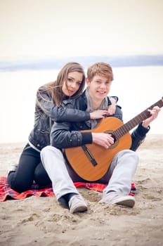 Teen couple on the beach