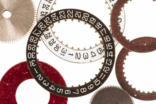 Watch cogs and date wheel or ring on white background
